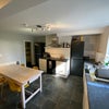 Photo 10: The huge kitchen with dining table and chairs