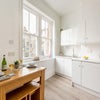 Photo 9: Modern, clean kitchen with diner