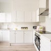 Photo 8: Modern, clean kitchen on 1st floor 