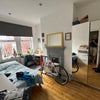 Photo 6: Big windows bathe the room in nature light