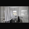 Photo 6: A private bathroom complete with roll top bath and shower.