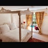 Photo 2: A beautiful large room complete with four pister bed.