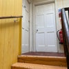 Photo 9: Top landing/ Stairway (public access). Room on left. 