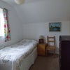 Photo 11: Single room before enlargement showing sloping ceiling