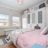 Photo 2: Furnished bedroom with bed and wardrobes