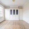 Photo 2: Empty bedroom with wardrobes and two windows