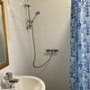 Photo 7: Clean and bright shared shower 