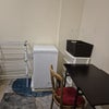 Photo 3: A freezer, indoor clothes airer, plastic storage & food shopping