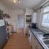 Photo 6: Kitchen with washing machine, tumble dryer and plenty storange