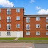Photo 2: FRONT EXTERIOR OF APARTMENT BUILDING