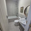 Photo 4: Large bathroom.