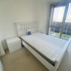 Photo 2: Bedroom with view. (Bed frame, mattress, and dresser are included)
