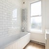 Photo 1: One of Three Bathrooms