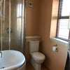 Photo 5: Shower and toilet 