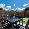 Photo 5: Lovely South facing garden with patio, table chairs, flower borders and low maintenance turf