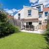 Photo 6: Lovely South facing garden with patio, table chairs, flower borders and low maintenance turf