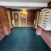Photo 8: Communal entrance and post room 