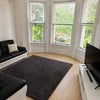Photo 4: Spacious living room with large TV and internet included