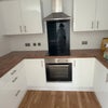 Photo 7: Kitchen with large fridge