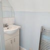 Photo 5: En-suite bathroom with hand basin and towel rail