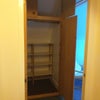 Photo 6: Built in Wardrobe and storage with doorway into room