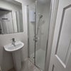 Photo 5: Downstairs shower and WC
