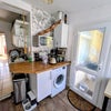 Photo 8: Microwave and washer