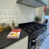Photo 13: Communal Kitchen and Living Area