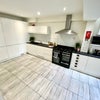 Photo 11: Communal Kitchen and Living Area