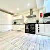 Photo 17: Communal Kitchen and Living Area