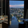 Photo 2: Floor-to-ceiling windows, setting sun, river view