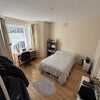 Photo 1: Front facing and spacious with lots of sunlight during the day