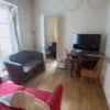 Photo 5: Shared living room with dining table