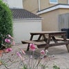 Photo 2: Rear yard, with picnic bench
