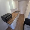 Photo 3: GF - Kitchenette w/ Counter top hob and oven 
