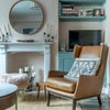 Photo 2: Living Room with leather bound books and lift top coffee table