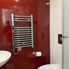 Photo 4: bathroom with heated towel rail, sink, mirror, shower, and toilet