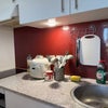 Photo 5: Kitchen area with sink, induction hob, and storage cupboards