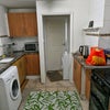 Photo 9: Kitchen with 2 door fridge , oven, microwave, dryer and washing machine