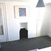 Photo 6: Has two wardrobes, fireplace, double bed, side table, space for a desk or chair and window faces qui