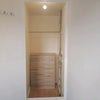 Photo 8: Walk in wardrobe with rail and chest of drawers