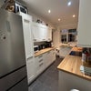 Photo 3: Tons of prep space, storage space, brand new large fridge, dishwasher, and door to small balcony