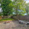 Photo 9: A large shared garden with garden furniture and barbecues.