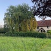 Photo 1: Cottage is just off village green