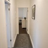 Photo 2: Hallway to Bedroom 