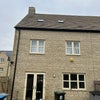 Photo 7: Back of the house (bedroom window is the top left)