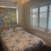 Photo 2: Second shot of room with shutters