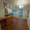 Photo 9: Kitchen half of shared space 