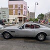 Photo 9: Trellick Tower seen over an Aston Martin parked at the Oporto Coffee shop