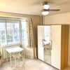 Photo 2: Bay window and large Cupboard